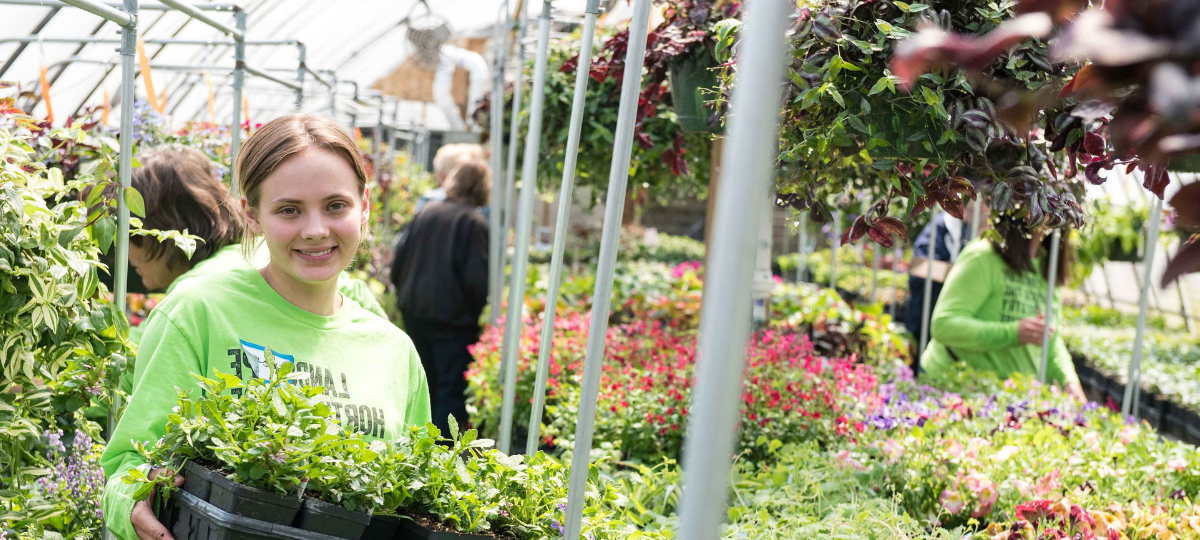 landscaping student in greenhouse