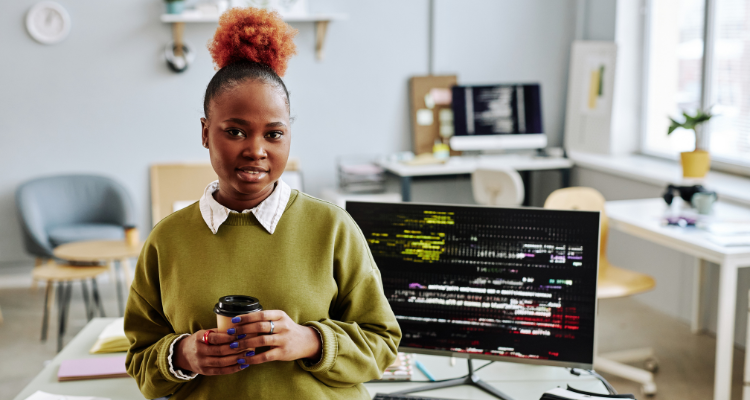 female database developer standing in front of desk