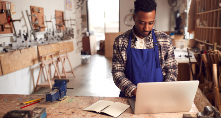 male entrepreneur running cabinet making business