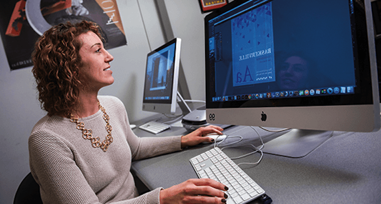 female graphic design student at computer