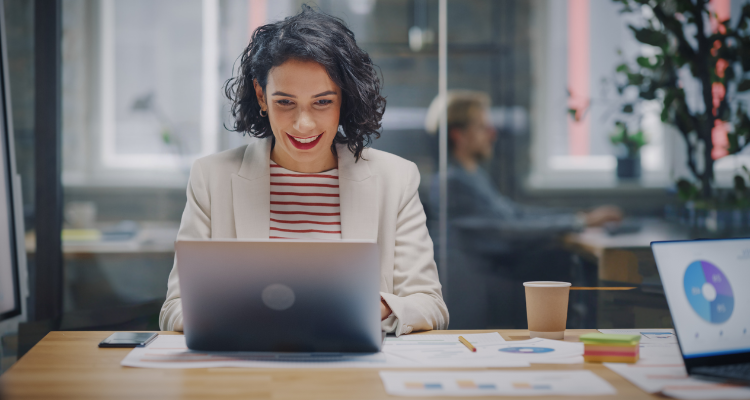 female working at desk in modern office