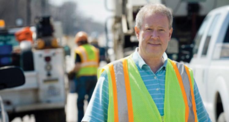male public works worker in high-visibility vest