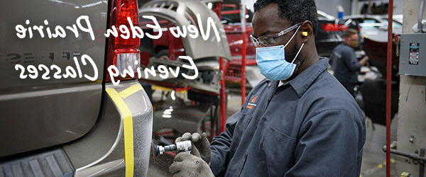 Man painting the rear bumper of a car