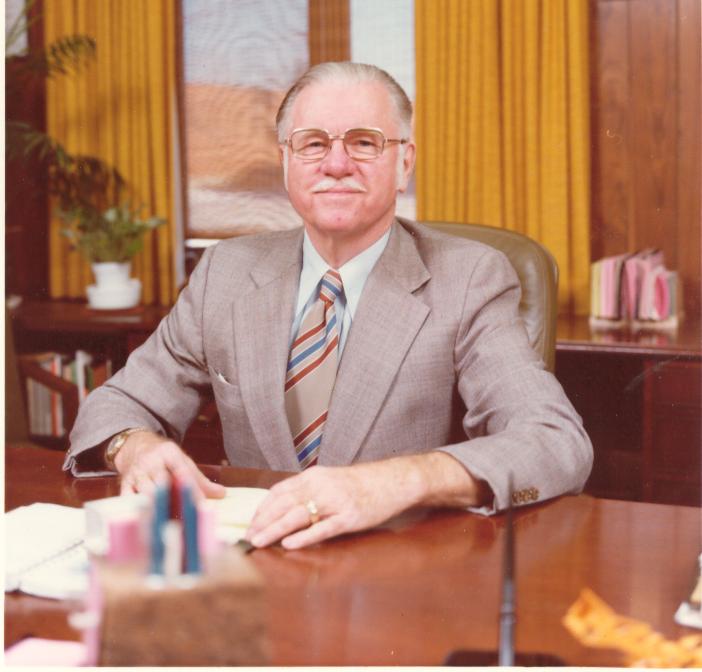 Dr. Richard Emery sits at a desk.