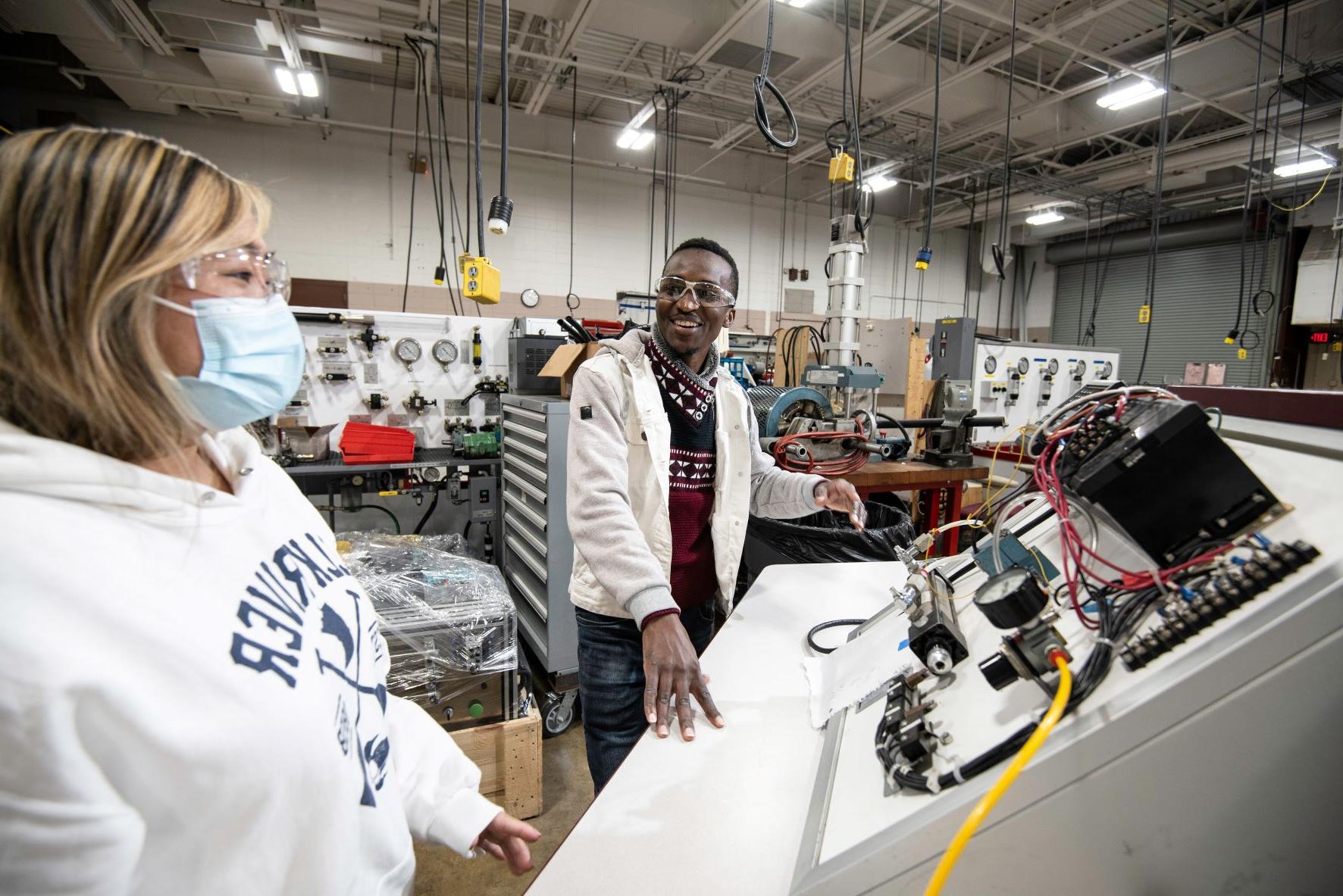 two students in Fluid Power lab