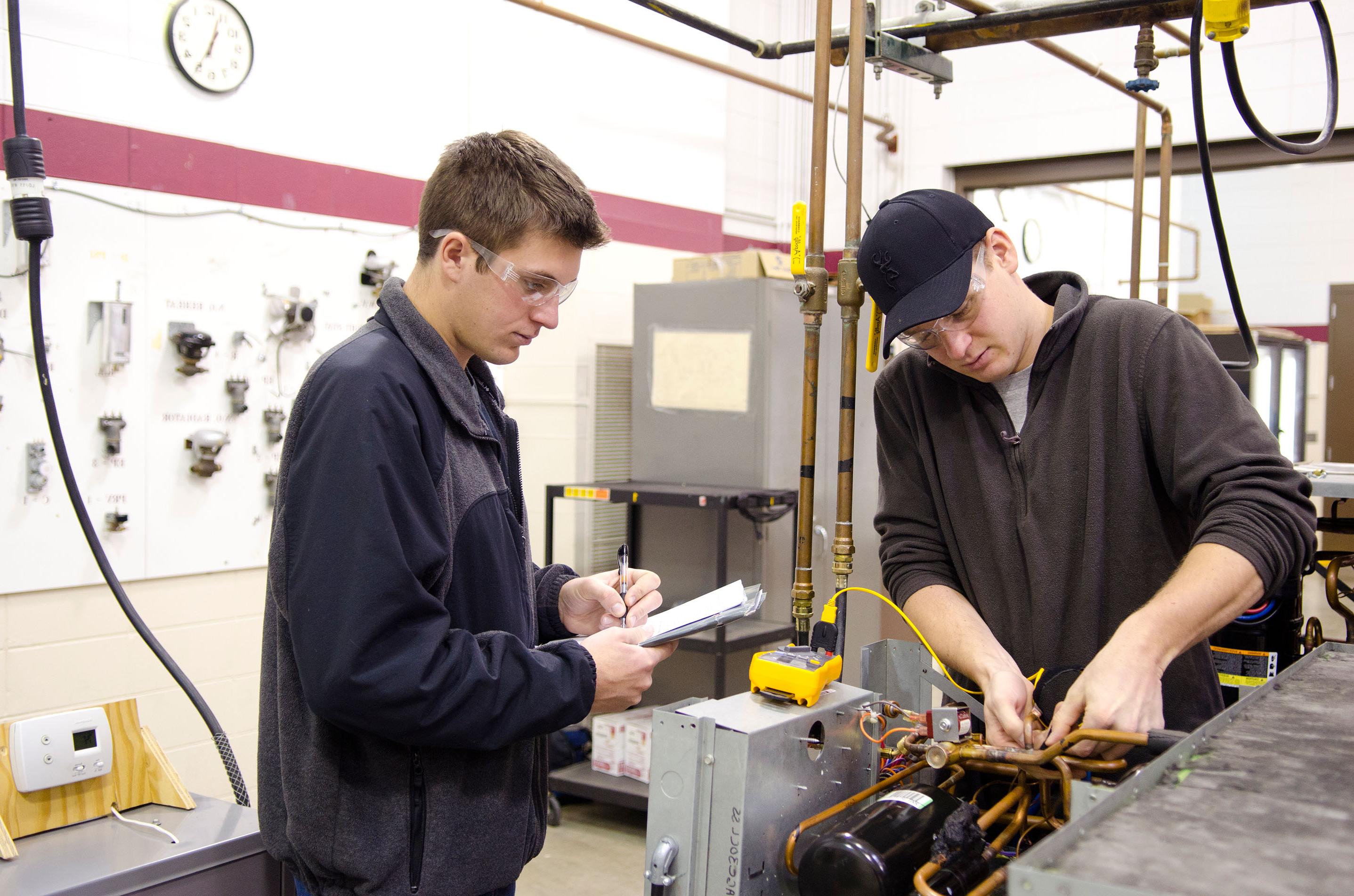 Two students in HVAC