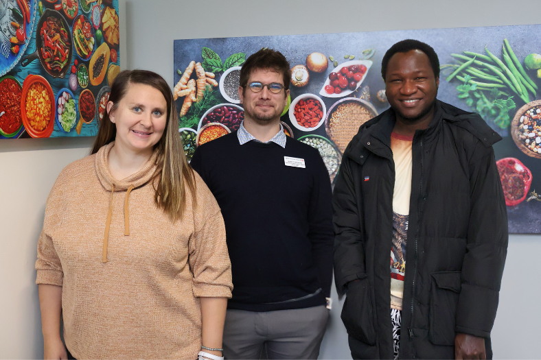 Student workers and Staff gathered in the new food pantry