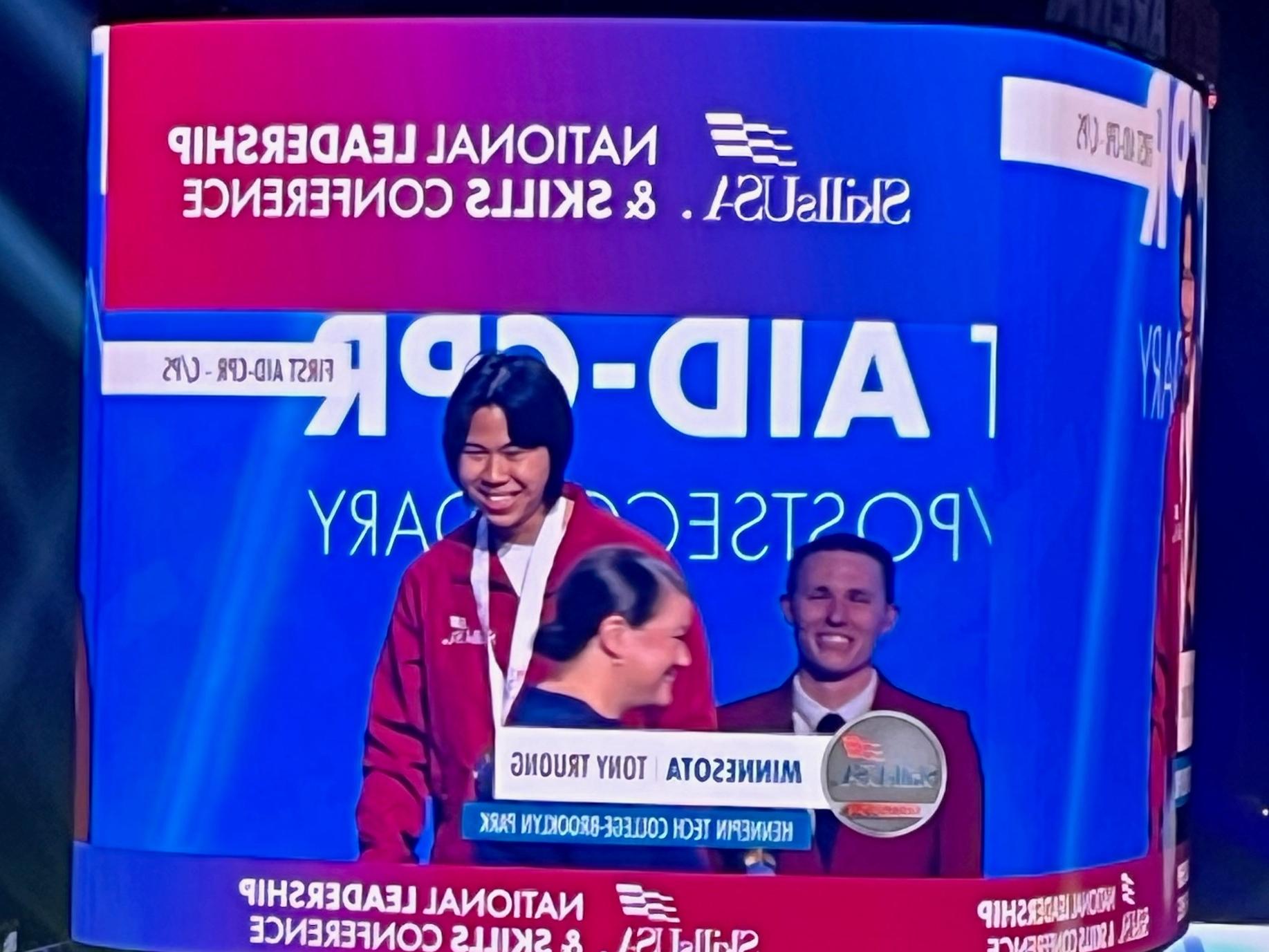 Student accepting medal
