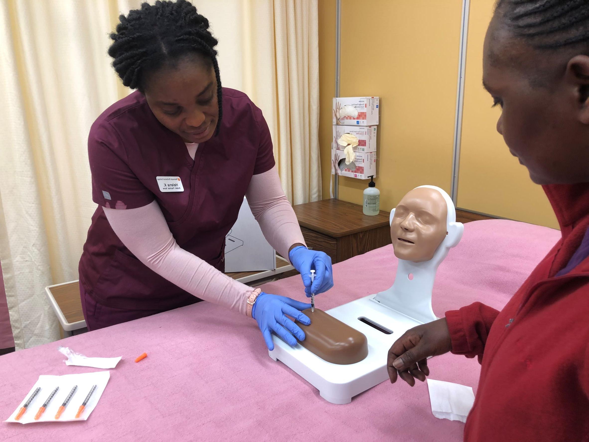 Nursing students practice skills