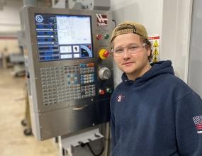 Hennepin Tech student Stephen Stolberg with machine