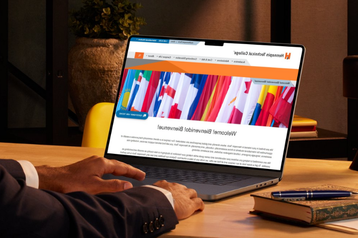 person on laptop navigating website update